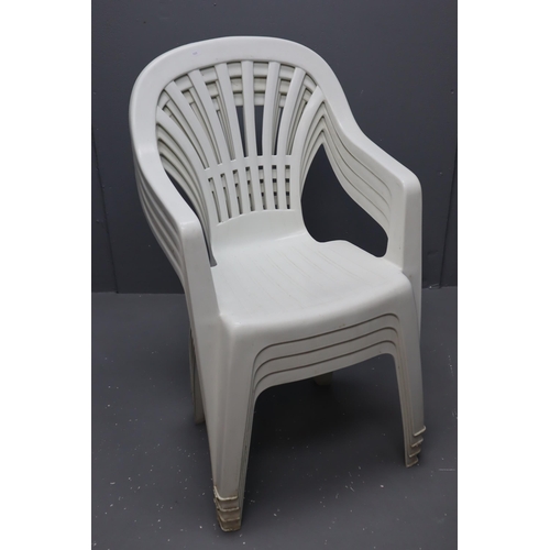 678 - Four Matching Plastic Garden Stacking Chairs