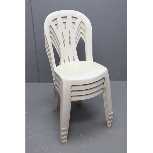 679 - Four Matching Plastic Garden Stacking Chairs