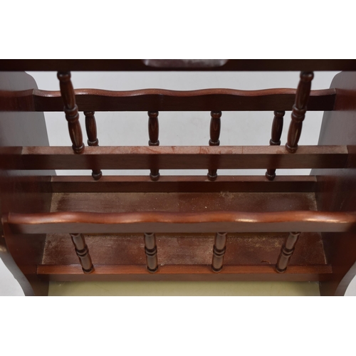 707 - Dark wood magazine rack measures 17