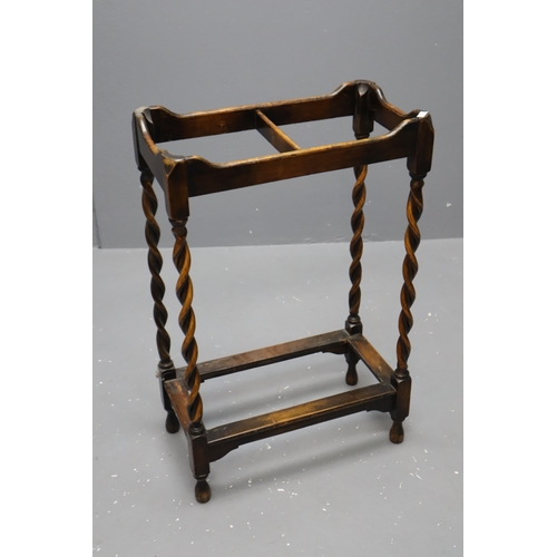 714 - Early 20th century oak umbrella stand with barley sugar legs, measures 27