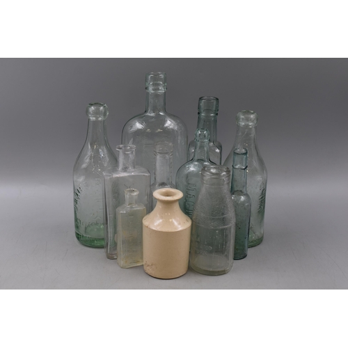 863 - Selection of 11 Vintage Glass Bottles including Wine Lodge, Dinneford, Auriflex and More