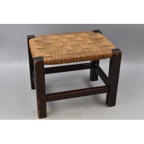 708A - Small wooden stool with string seat measures 12