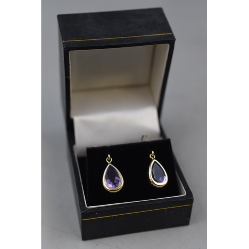 39 - Pair of 10ct Mexican Gold Drop Earrings with Purple Stone. Complete with Presentation Box.