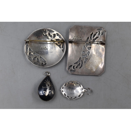 42 - A Selection of Siam Silver Niello Jewellery. Includes Two Pendants and Two Brooches