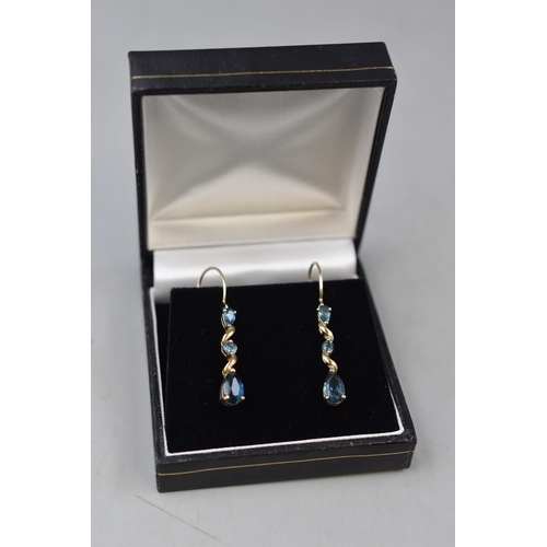 50 - Pair of 9ct Gold Drop Earrings with Teal Sapphire Coloured Stone. Complete with Presentation Box