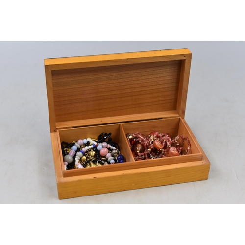 122 - Decorative Wooden Box to include a Selection of Jewellery items. Includes Silver