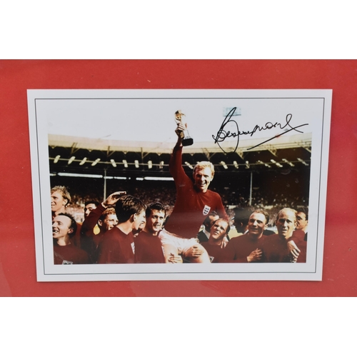 604 - Bobby Moore Signed World Cup Photograph and a Signed Picture of England's Women's Footballers