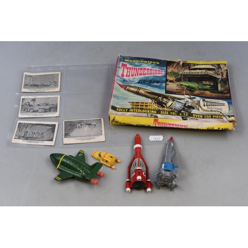 185 - Selection of Thunderbirds Memorabilia including Jigsaw (unchecked) Collectors Cars and Models