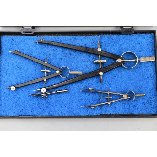 225 - Three Vintage Compasses in plastic storage case