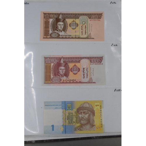 236 - Folder Containing a Large Selection of Worldwide Uncirculated Bank Notes. Includes Mongolia, Ukraine... 