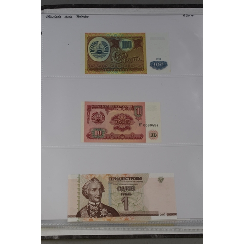 236 - Folder Containing a Large Selection of Worldwide Uncirculated Bank Notes. Includes Mongolia, Ukraine... 