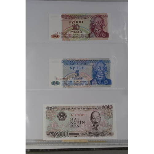 236 - Folder Containing a Large Selection of Worldwide Uncirculated Bank Notes. Includes Mongolia, Ukraine... 