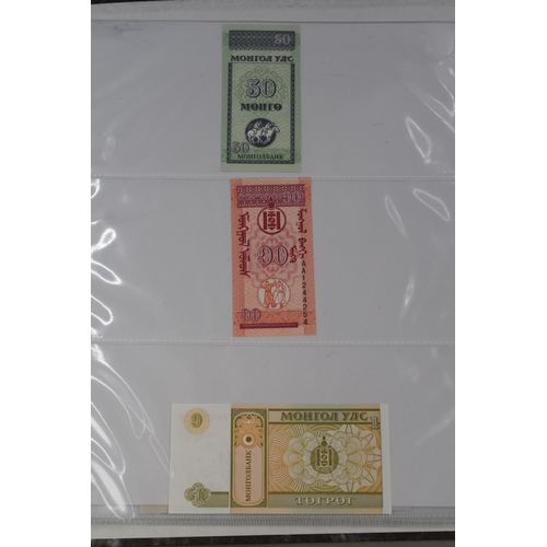 236 - Folder Containing a Large Selection of Worldwide Uncirculated Bank Notes. Includes Mongolia, Ukraine... 