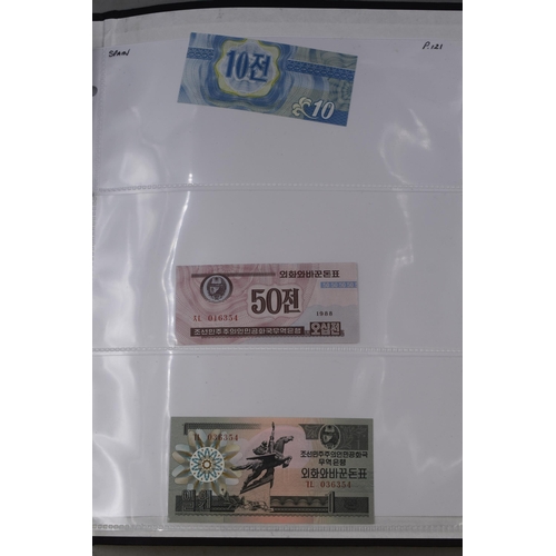 237 - Folder Containing a Large Selection of Worldwide Uncirculated Bank Notes. Includes Cambodia, Banglad... 