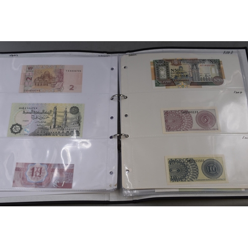 237 - Folder Containing a Large Selection of Worldwide Uncirculated Bank Notes. Includes Cambodia, Banglad... 