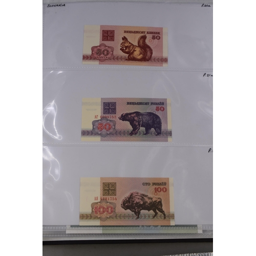 237 - Folder Containing a Large Selection of Worldwide Uncirculated Bank Notes. Includes Cambodia, Banglad... 