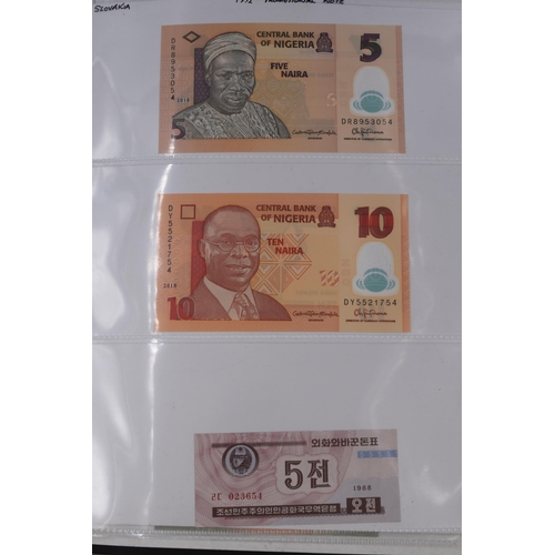 237 - Folder Containing a Large Selection of Worldwide Uncirculated Bank Notes. Includes Cambodia, Banglad... 