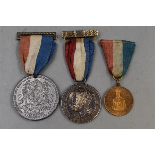 268 - George V Daily Mail Teddy Tail League 1935 Medallion, and two George V 1911 Coronation Medals all wi... 