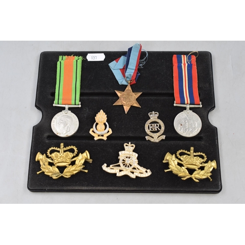 269 - Group of 3 World War 2 Medals War, Defence and 39-45 Star, all with Ribbons and 5 Military Badges