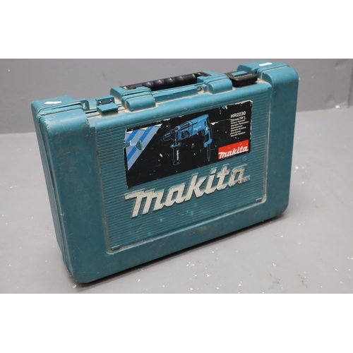 752 - Makita Rotary Hammer Drill in Case (Powers on)