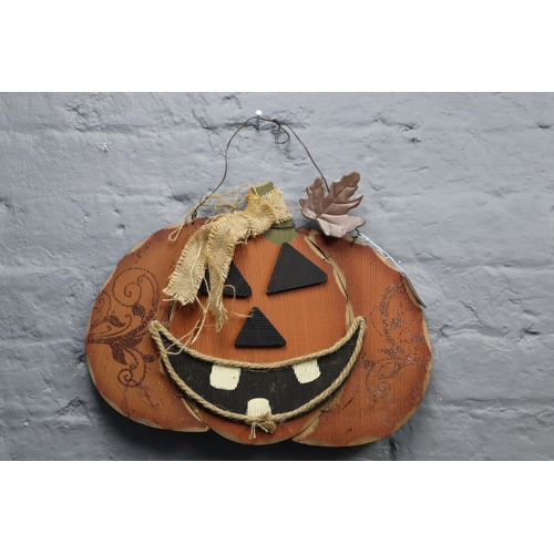 696 - Creepy Hanging Wooden Pumpkin (16” x 11”)