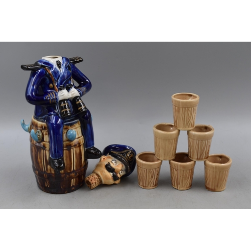 303 - A Novelty Ceramic Ships Captain Decanter, With Six Shot Mugs. One Mug AF