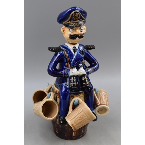 303 - A Novelty Ceramic Ships Captain Decanter, With Six Shot Mugs. One Mug AF