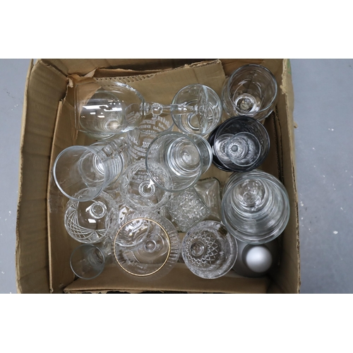 857 - A Box of Assorted Glassware. To Include Decanter, Pint Glasses, Cocktail Shaker, And More