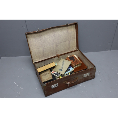 881 - Vintage suitcase with a selection of vintage books, cigarette cards, tins and others