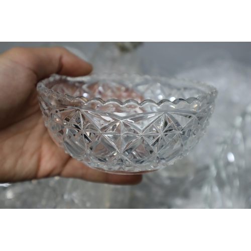 886 - A Large Selection of Cut Crystal Ware. Includes Vases, Drinking Glasses, Bowls and More