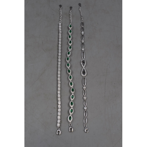 28 - Three Silver 925 Bracelets to include Green Stone Design and Infinity Design