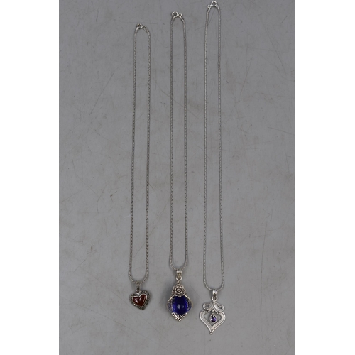 54 - Three Silver 925 Pendant Necklaces. Includes Marcasite Heart, Floral Blue Stone and Purple Stoned He... 