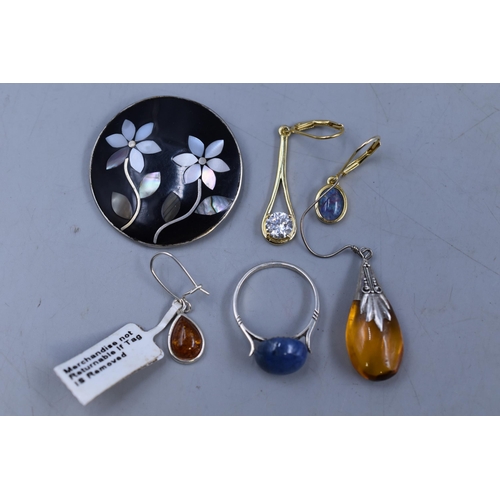 62 - A Selection of Jewellery Pieces To Include Amber Stoned Earring, Opal effect 925. Silver Earring and... 