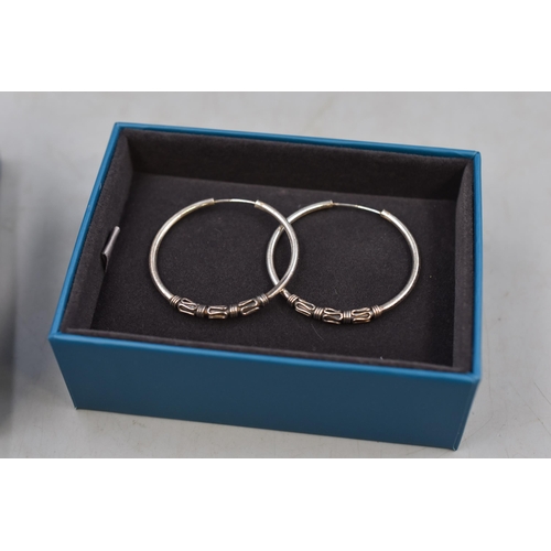 64 - Two Jewellery items to include SheGrace Silver 925 Hoop Earrings and a Megidesi Bunny Necklace. Comp... 