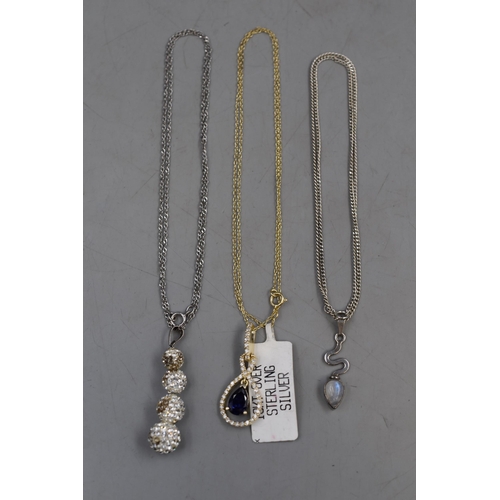 65 - Three Silver 925 Necklaces to include ‘S’ Moon Stone Necklace, Purple Stoned Necklace an... 