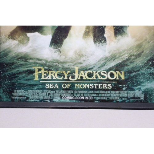 401 - Signed Framed and Glazed Percy Jackson Film Poster (13” x 17”). Signed by Logan Lerman, ... 