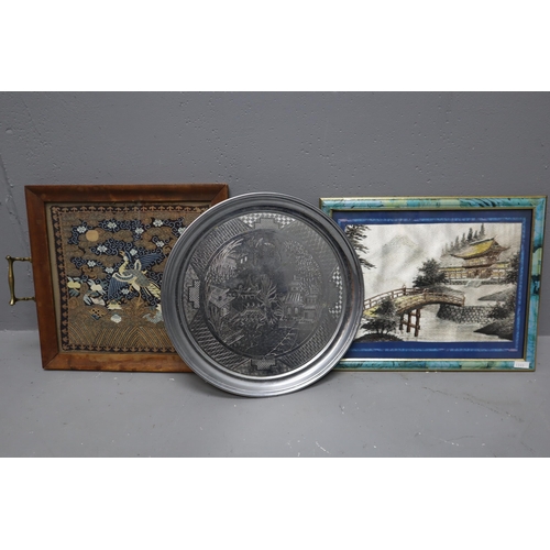 480 - Three oriental pieces to consist of a wooden tray with brass handles and a bird design on cloth 14