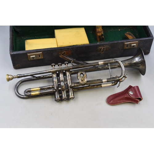 507 - Trumpet with engraved body in case.