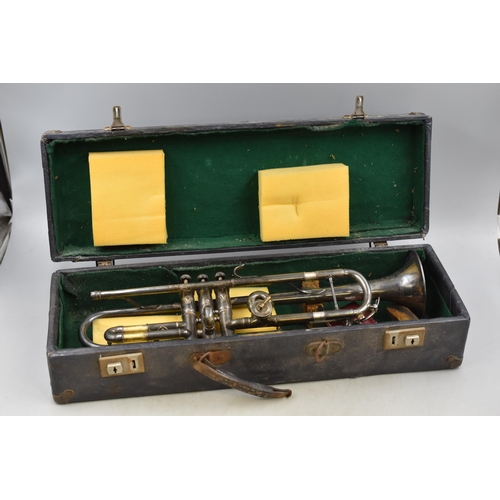 507 - Trumpet with engraved body in case.