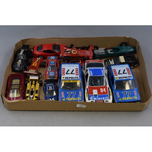 548 - A Selection of Playworn Diecast Racing Vehicles To Include Bburago