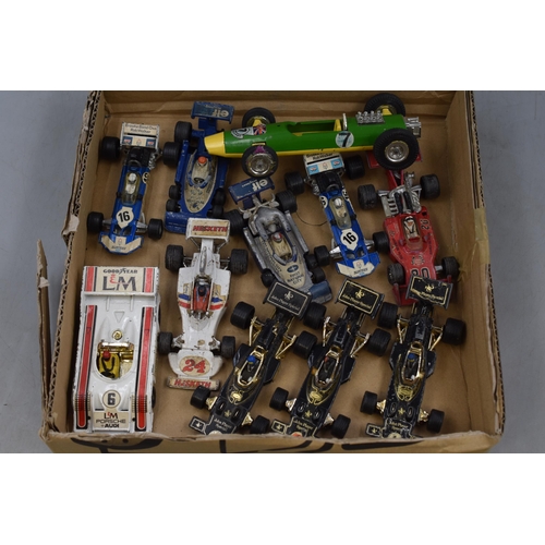 549 - A Selection of Playworn Diecast Racing Vehicles. To Include Corgi and Triang