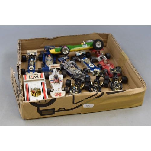 549 - A Selection of Playworn Diecast Racing Vehicles. To Include Corgi and Triang