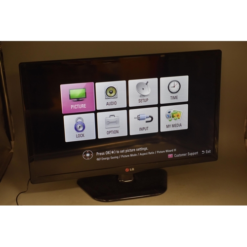 555 - LG 24MT 45D 24 inches TV with Remote Control (powers on when tested)