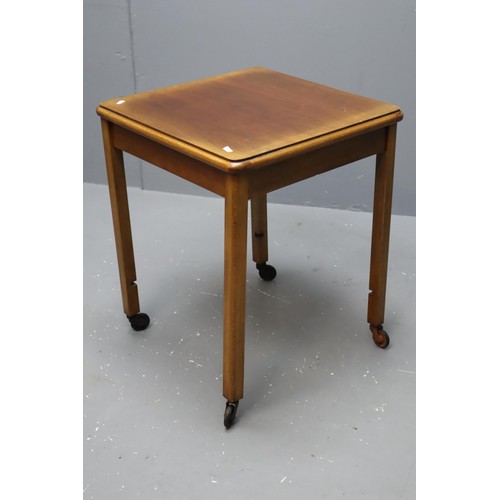 566 - Three items to include Small square vintage wooden table on castors measures 24