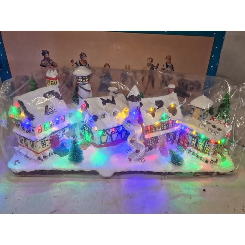 580 - Two Boxed Christmas Items Includes Premier Large Lit Village Scene and a Large Figures12 Piece Delux... 