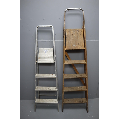 666 - Two pairs of step ladders one aluminium measuring 56