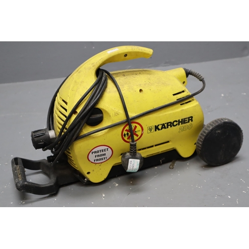 633 - Karcher 200M power washer with spare lance and hose, powers on when tested