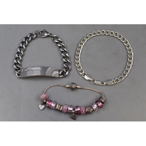 44 - Three Bracelets Two Silver Including Silver Charms and One Stainless Steel (Ben Sherman)