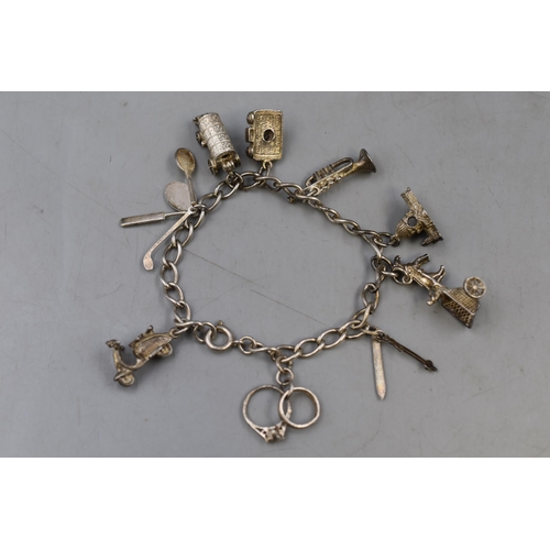 54 - Silver 925 Charm Bracelet with Nine Charms