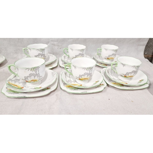 407 - Roslyn 20 pieces Bone China Tea Set. 6 Trios, Milk Jug and Sugar Bowl